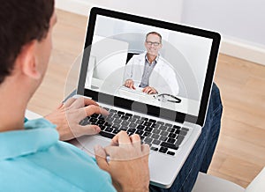 Man having video chat with doctor