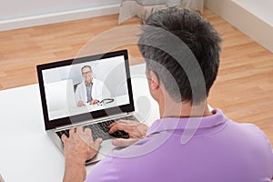 Man having video chat with doctor