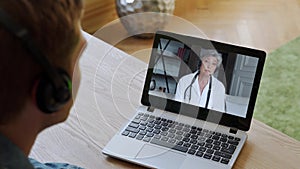 Man having video conferencing with online woman doctor. Remote patient consulting video call in conference virtual