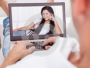Man Having A Videochat With Woman photo