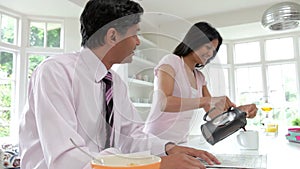 Man Having With Wife Breakfast Before Going To Work