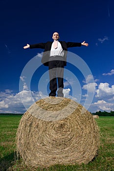Man on hay bale