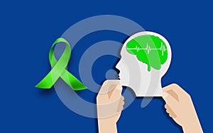 Man Head With green Brain sign and Awareness Ribbon symbol on blue background, World Mental health concept