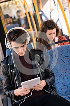 man in headphones with digital tablet