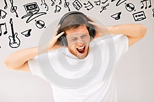 Man with headphones listening loud music