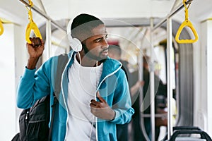 Man In Headphones Listening Music Riding In Transport