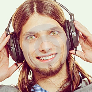 Man with headphones listening to music. Leisure.