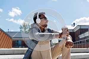 Man in headphones listening to music on roof top