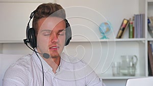 man with headset and laptop