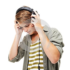 Man, headset and listening to music for podcast, audio streaming or DJ against a white studio background. Male person or