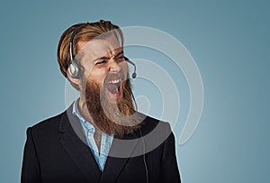 Man with headset working as operator shouting with anger