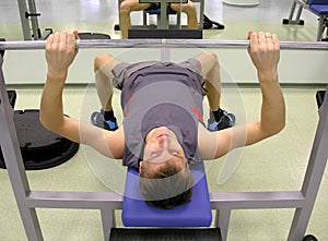 Man in health club with barbell