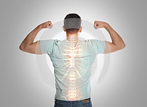Man with healthy back on background. Spine pain prevention photo
