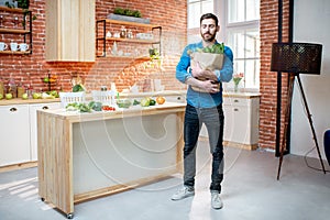 Man with healthy food on the kitchen