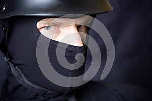 Man in helmet and mask staring at you