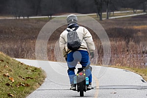 Man in a helmet rides a bicycle on the road