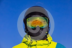 man in helmet and ski mask. reflection. winter activity