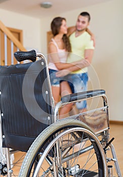 Man helping his disabled wife