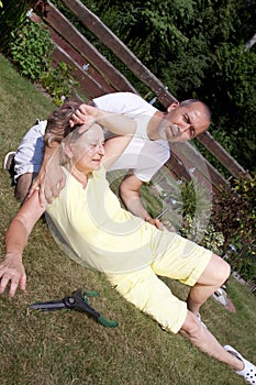 Man helping woman with heatstroke