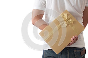 Man hiding a golden gift box giving