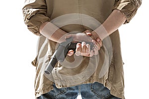 Man hiding gun behind his back