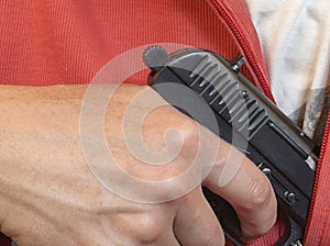 Man Hiding Gun