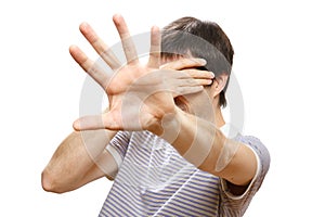 Man hiding his face with the hands