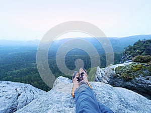 Man hiker climb rock on mountain peak cliff. Concept of sport and active life.