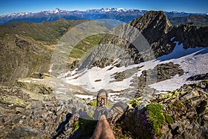 Man hiker rest during a trekking in mountain and contemplate panorama