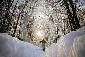 Man hiker on a snowy mountain