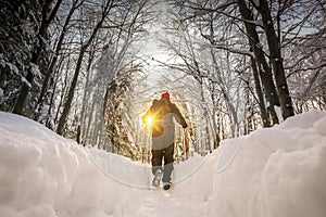Man hiker on a snowy mountain