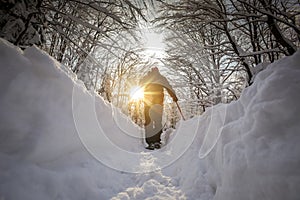 Man hiker on a snowy mountain