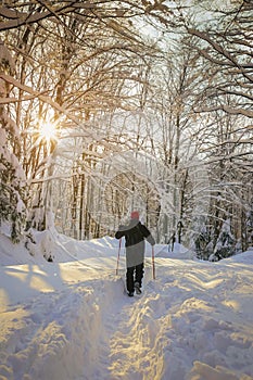 Man hiker on a snowy mountain