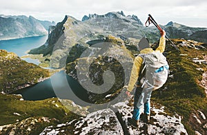 Man hiker standing on cliff mountain top