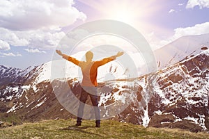 Man hiker on a top of a mountain