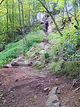 Man hikes steep stone steps up Poke O Moonshine Trail photo