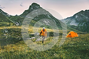 Man hiking alone solo traveling camping adventure lifestyle concept