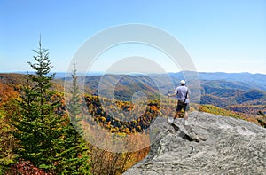 Man hiking in autumn mountains.