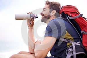 Man, hiking and break for water, health and wellness with bottle and mountain. Athlete, exercise and adventure with