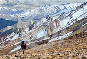 Man hiking in Himalaya mountains photo