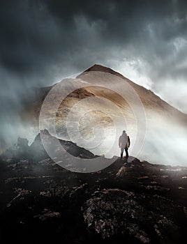 Man Hiking On A Misty Mountain