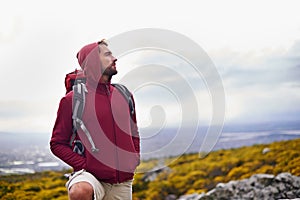 Man, hiking and mountain with bag in nature, Germany nature trail on wildlife conservation. Active, male person on