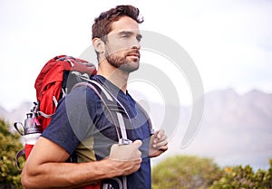 Man, hiking and mountain for fitness, health and wellness with view and nature. Athlete, exercise and adventure with