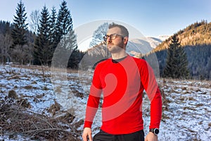 Man hiking on mountain with Mid-layer on