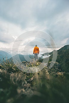 Man hiking in mountains adventure traveling solitude lifestyle