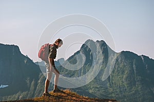 Man hiking in mountains travel backpacking summer vacations outdoor photo