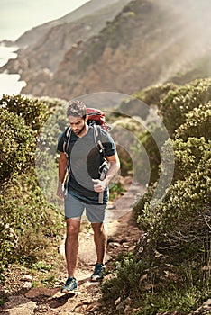 Man, hiking and nature for cardio, health and wellness with back and mountain. Athlete, exercise and adventure with