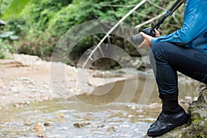 Man is hiking outdoor with river and take picture concept Lifestyle Travel.