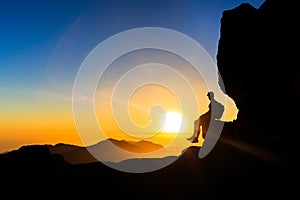 Man hiking silhouette in mountains sunset freedom