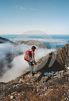 Man hiking solo on mountain ridge travel lifestyle adventures active outdoor vacation photo